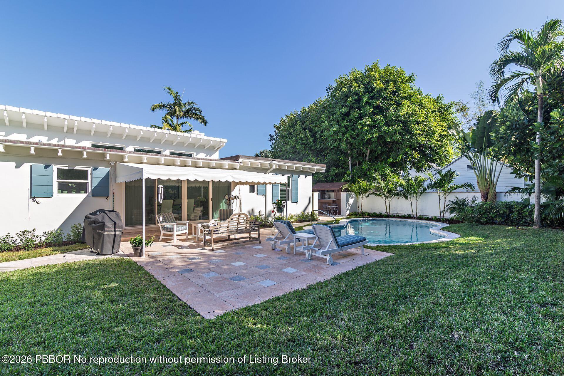 224 Churchill Road West Palm Beach, FL 33405 - Photo 19 of 33 a view of a house with backyard porch and sitting area