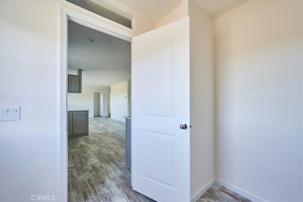 5430 Luna Road Phelan, CA 92371 - Photo 19 of 34 a view of a room with wooden floor