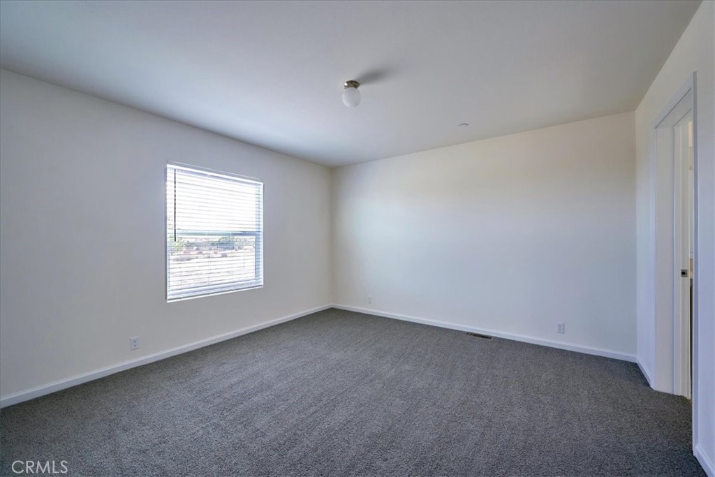 5430 Luna Road Phelan, CA 92371 - Photo 21 of 34 an empty room with a window