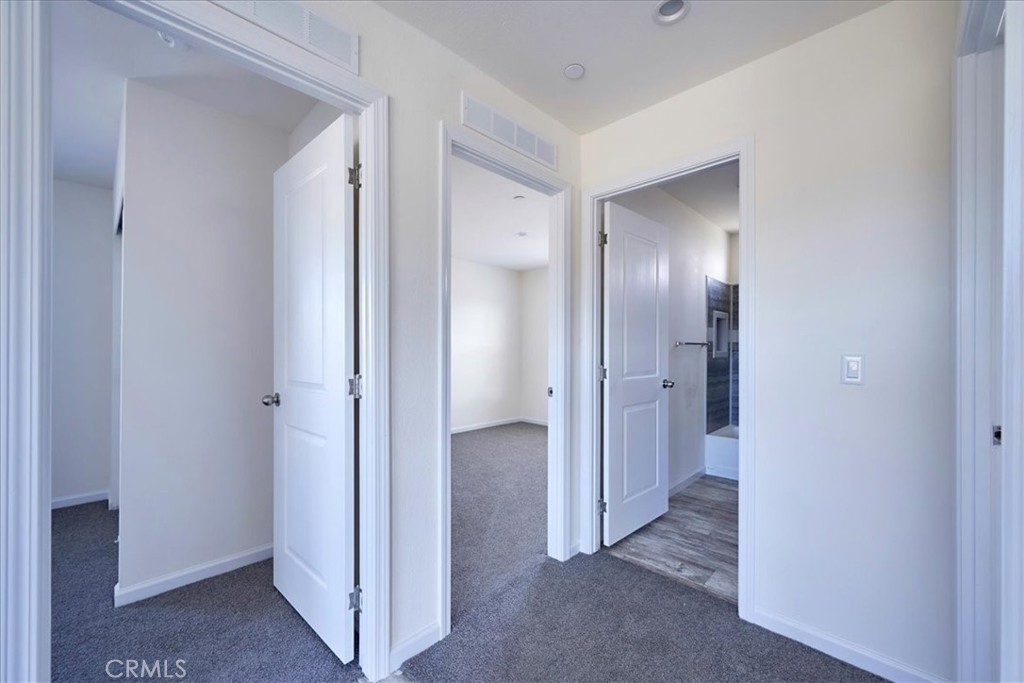 5430 Luna Road Phelan, CA 92371 - Photo 27 of 34 a view of a hallway with wooden floor