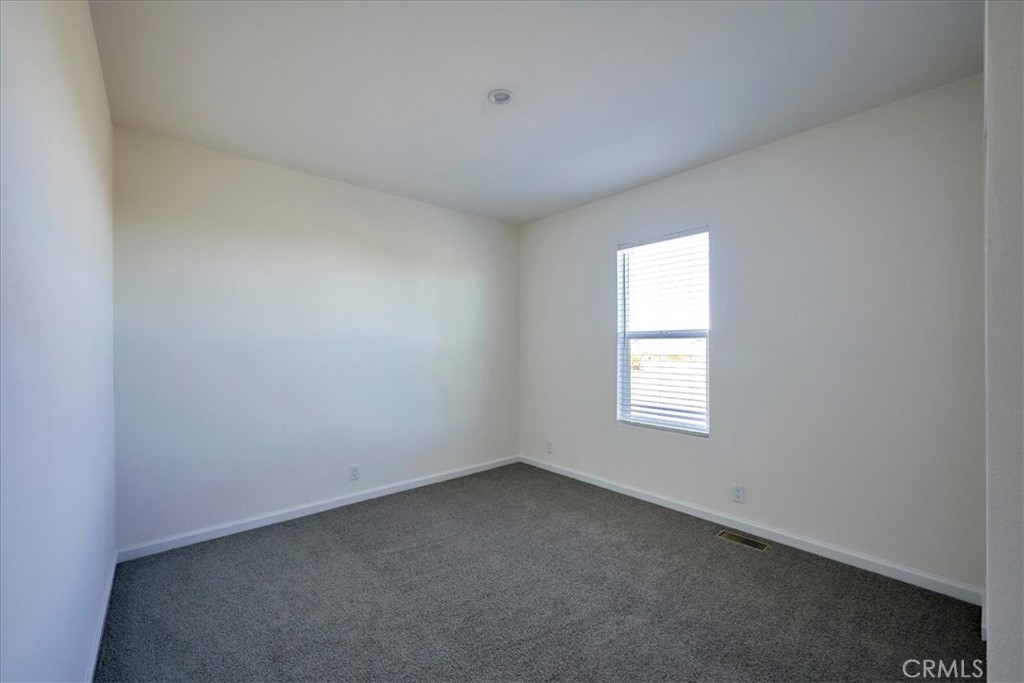 5430 Luna Road Phelan, CA 92371 - Photo 28 of 34 an empty room with a window