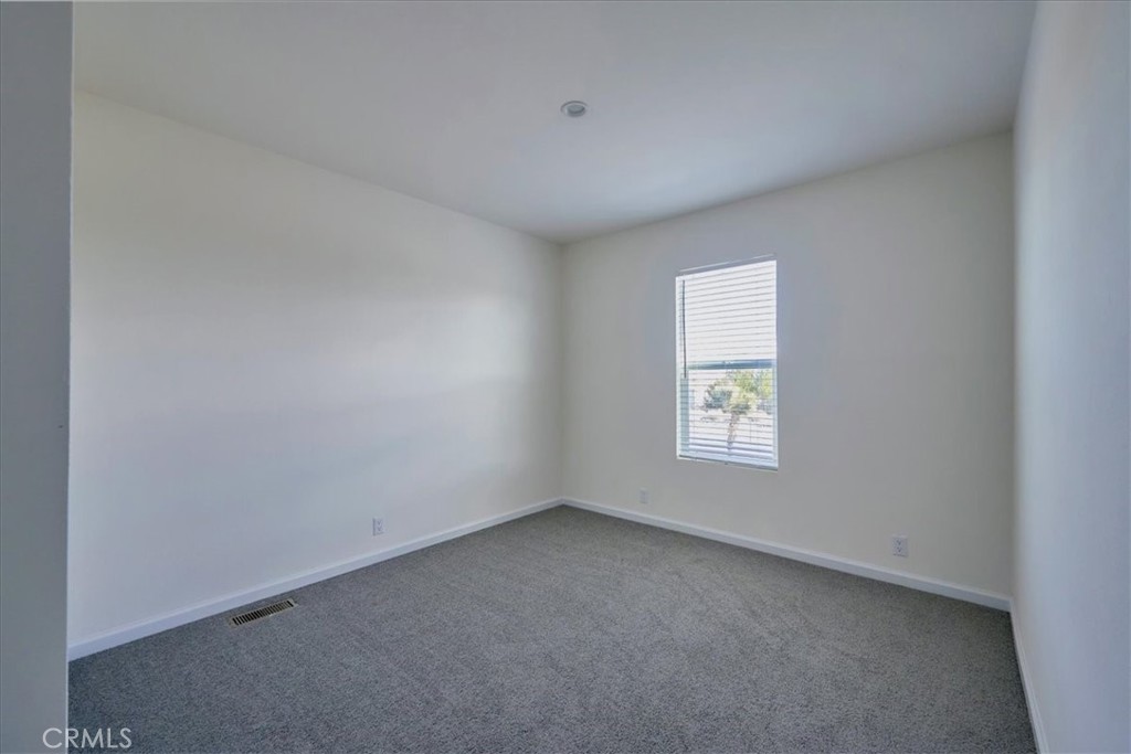 5430 Luna Road Phelan, CA 92371 - Photo 30 of 34 a view of an empty room with a window