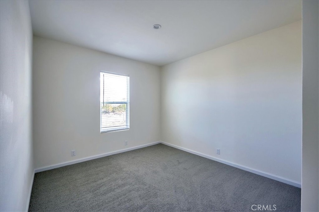 5430 Luna Road Phelan, CA 92371 - Photo 33 of 34 an empty room with a window