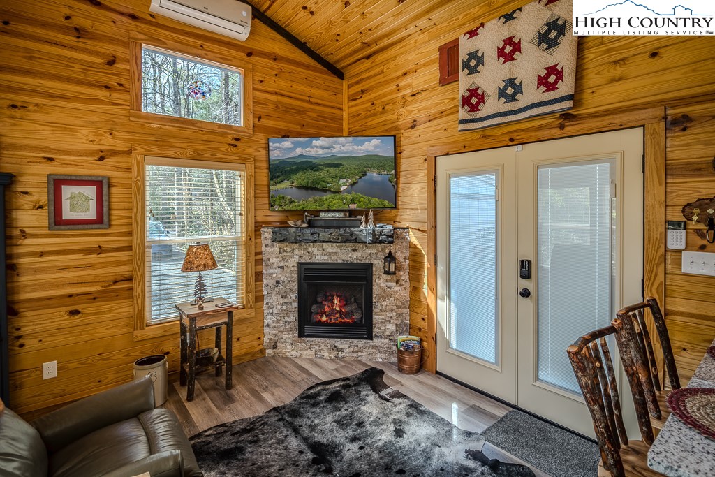 793 Highland Hills Road Newland, NC 28657 - Photo 11 of 40 a living room with furniture and a fireplace