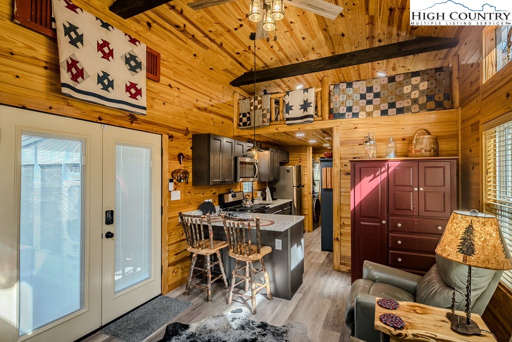 793 Highland Hills Road Newland, NC 28657 - Photo 12 of 40 a view of a chairs and table in a patio