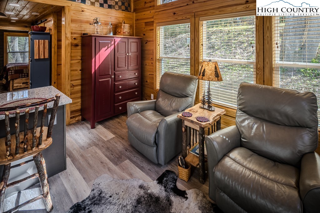 793 Highland Hills Road Newland, NC 28657 - Photo 14 of 40 a living room with furniture a flat screen tv and a window