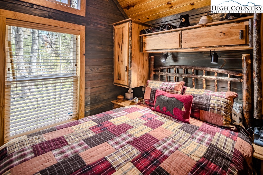 793 Highland Hills Road Newland, NC 28657 - Photo 22 of 40 a bed sitting in front of a building