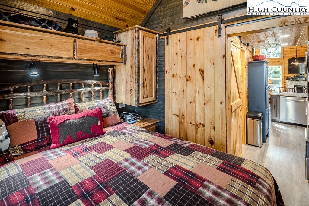 793 Highland Hills Road Newland, NC 28657 - Photo 24 of 40 a bed sitting in a bedroom next to a window