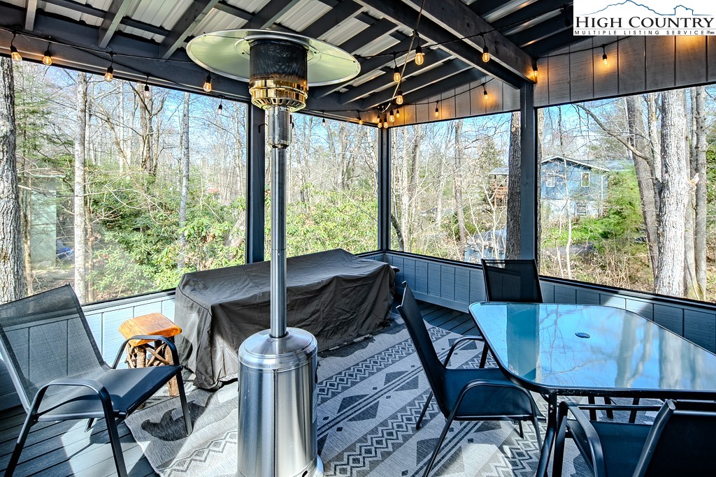 793 Highland Hills Road Newland, NC 28657 - Photo 31 of 40 a view of a dining room with furniture window and outside view