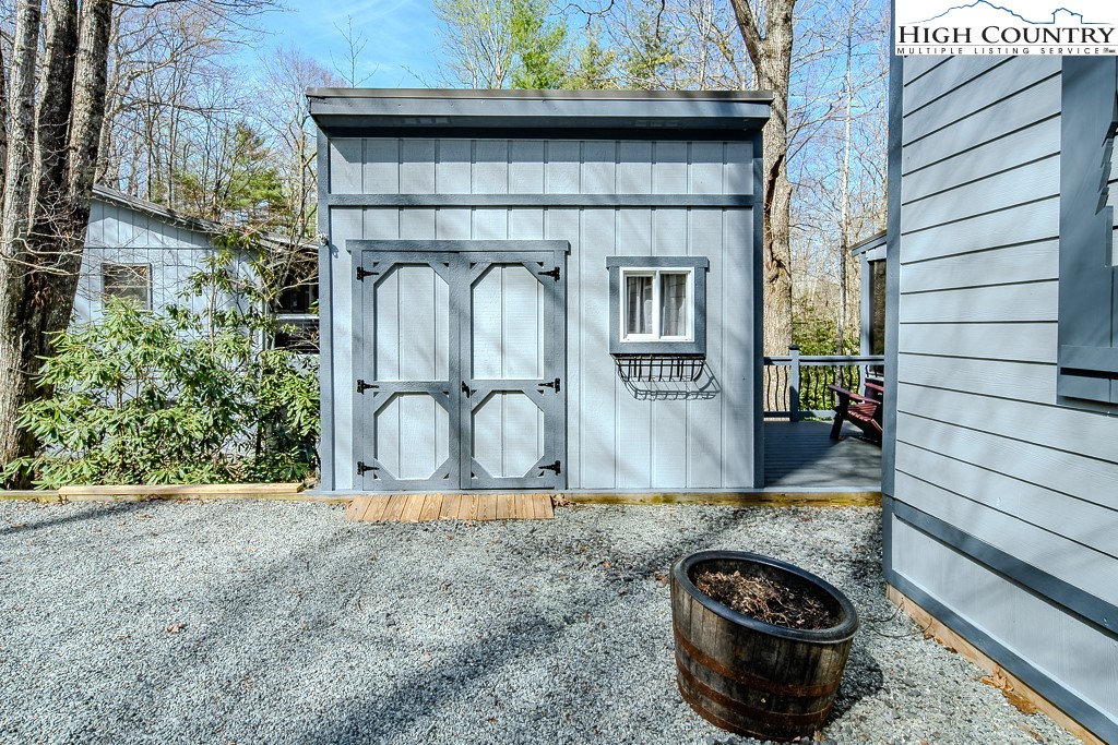 793 Highland Hills Road Newland, NC 28657 - Photo 35 of 40 a front view of a house with garden