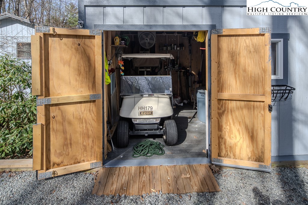 793 Highland Hills Road Newland, NC 28657 - Photo 36 of 40 a kitchen with a refrigerator and wooden floor