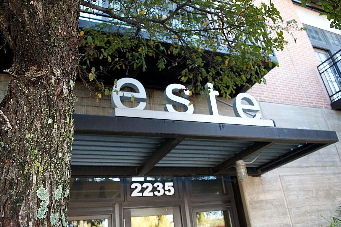 2235 East 6th Street, Unit 404 Austin, TX 78702 - Photo 26 of 37 a view of a brick house with a iron gate
