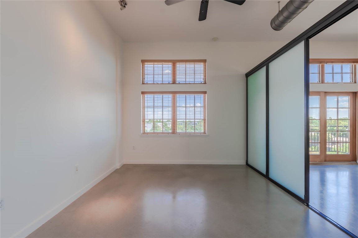 2235 East 6th Street, Unit 404 Austin, TX 78702 - Photo 9 of 37 an empty room with windows