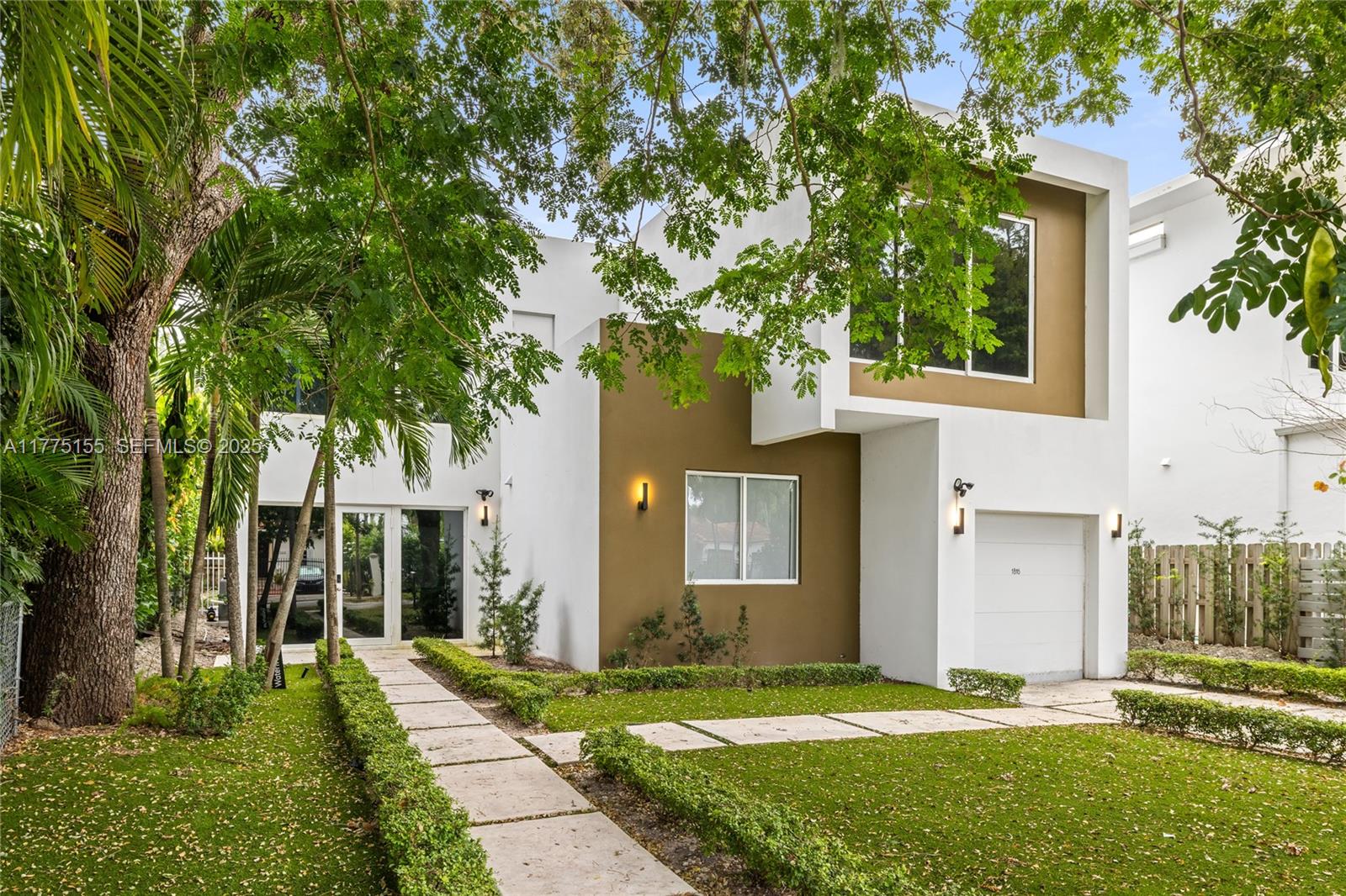 1816 Southwest 23rd Street Miami, FL 33145 - Photo 33 of 34 a front view of a house with a yard