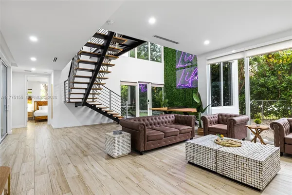 a living room with furniture or window and a wooden floor