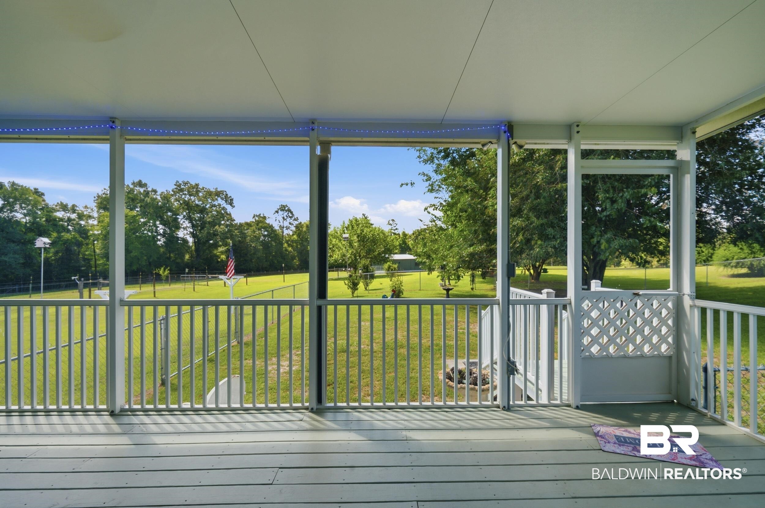 15855 Calvin Richerson Road Bay Minette, AL 36507 - Photo 19 of 83 Screened porch featuring wood-finish decking and integrated soffit lighting