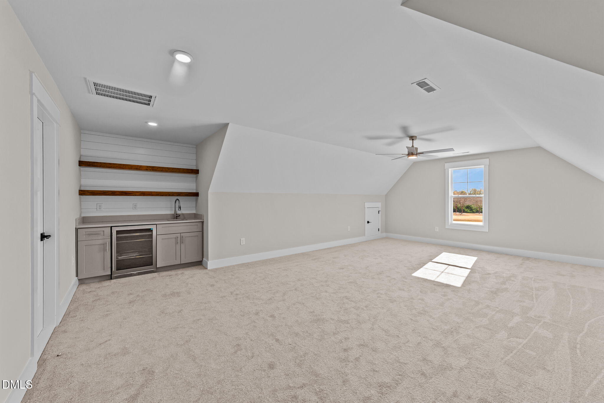 2568 Lassiter Road Four Oaks, NC 27524 - Photo 31 of 50 an empty room with windows and fireplace