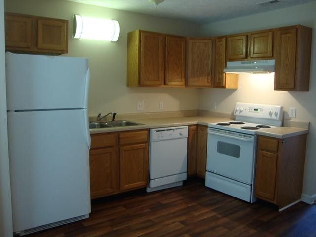 1002 Division Street, Unit 1002 Murfreesboro, TN 37130 - Photo 8 of 15 a kitchen with a refrigerator sink and cabinets