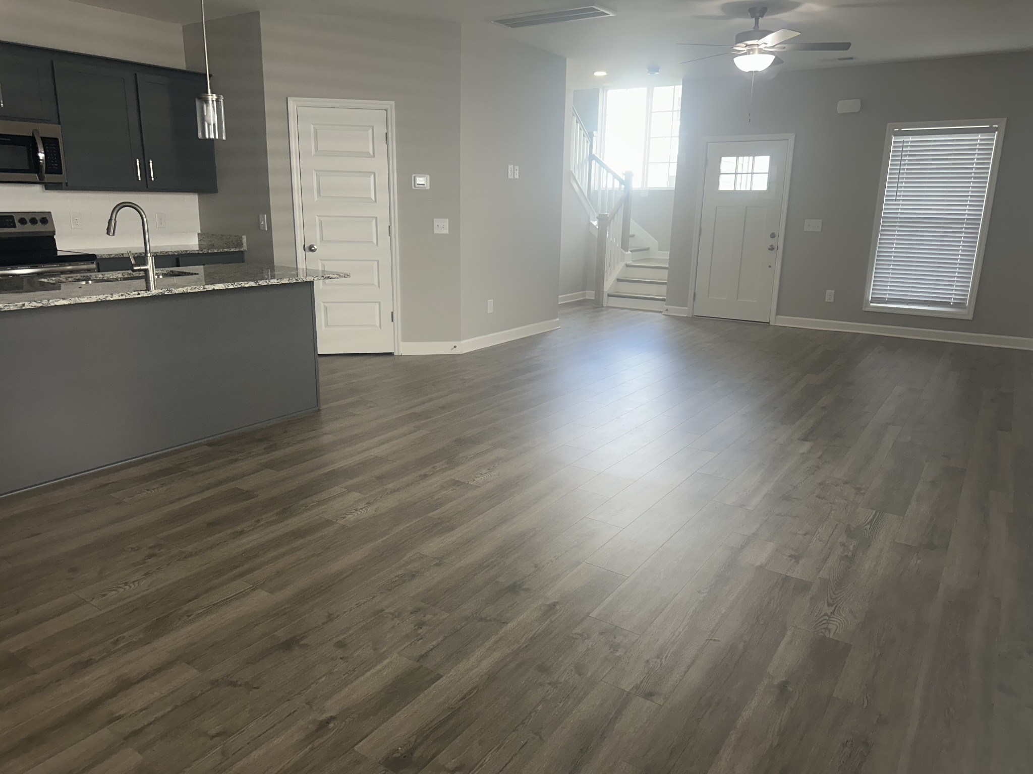 1721 Fenway Loop Antioch, TN 37013 - Photo 12 of 35 a view of a kitchen with a sink and dishwasher with wooden floor