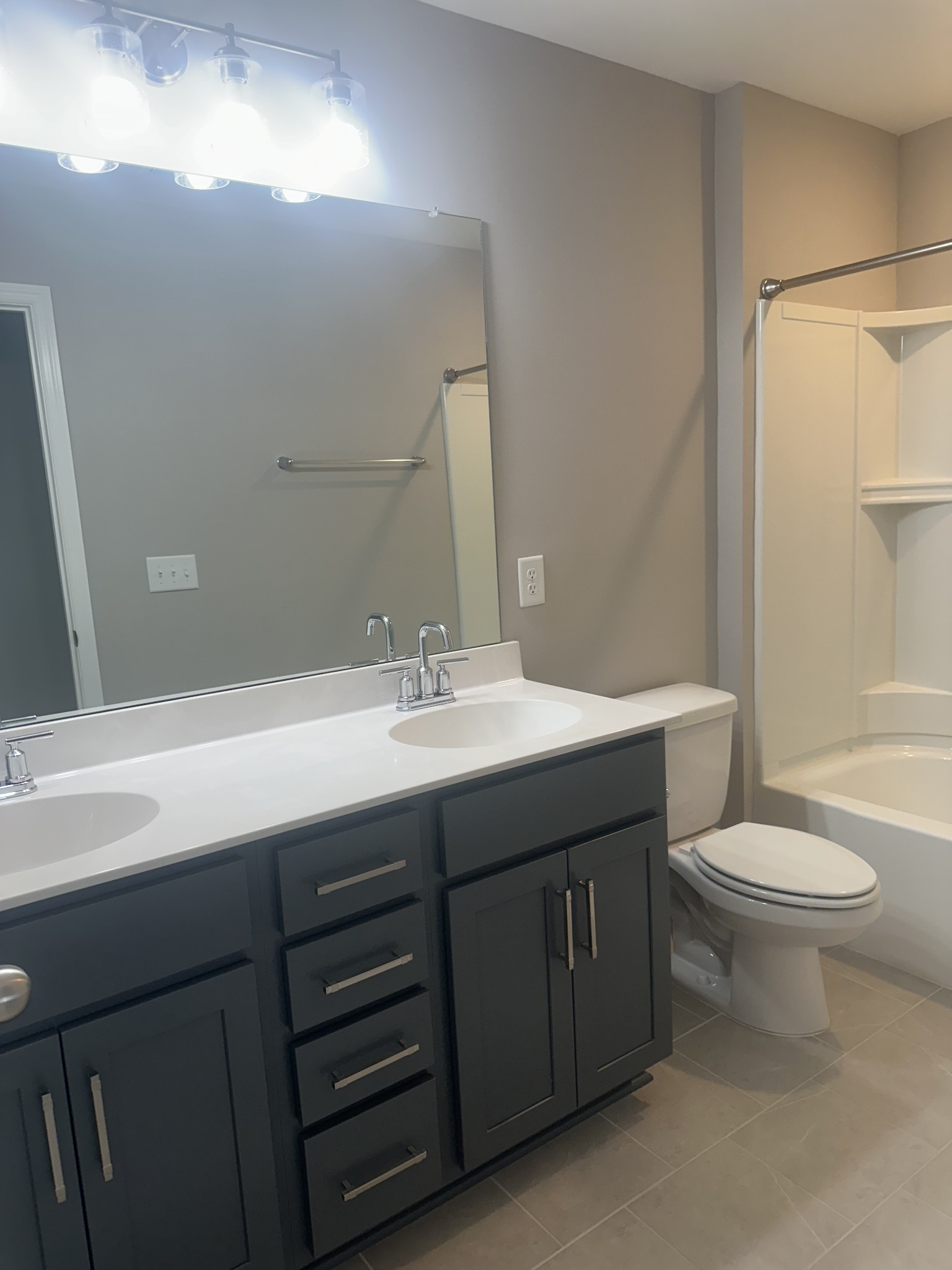 1721 Fenway Loop Antioch, TN 37013 - Photo 17 of 35 a bathroom with a double vanity sink toilet and a mirror