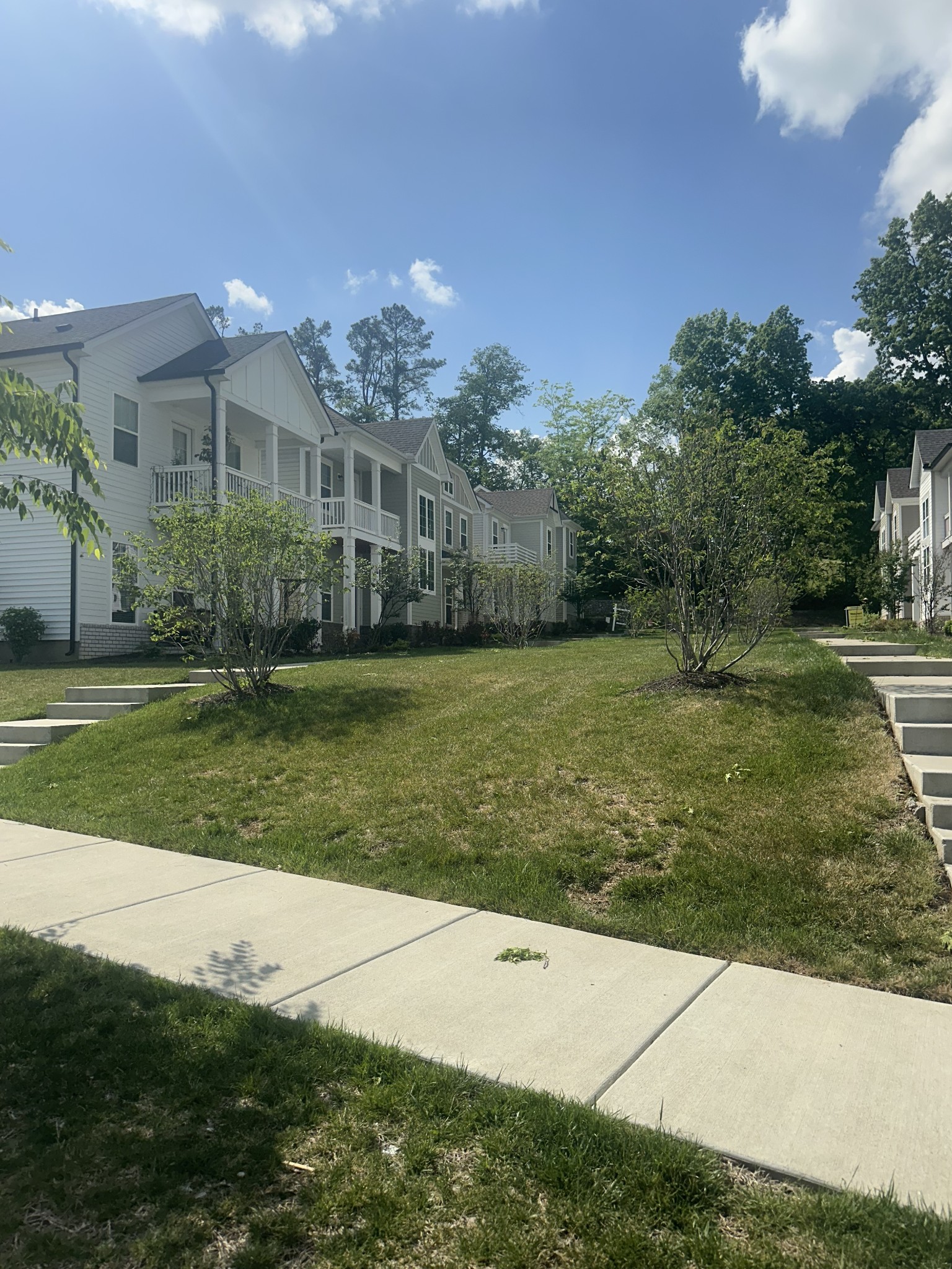 1721 Fenway Loop Antioch, TN 37013 - Photo 2 of 35 a view of a big yard with potted plants and large trees