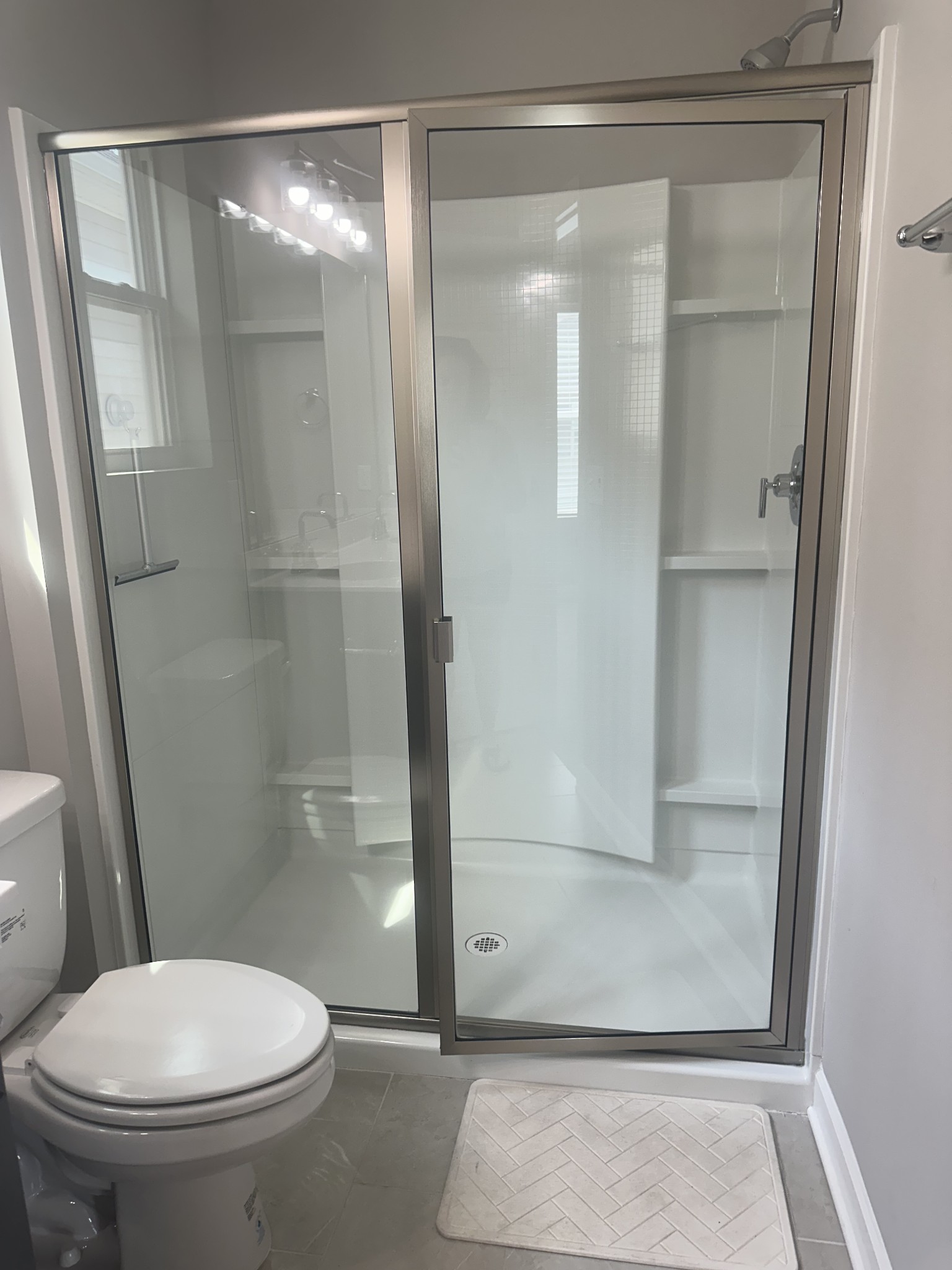 1721 Fenway Loop Antioch, TN 37013 - Photo 28 of 35 a bathroom with a glass shower door
