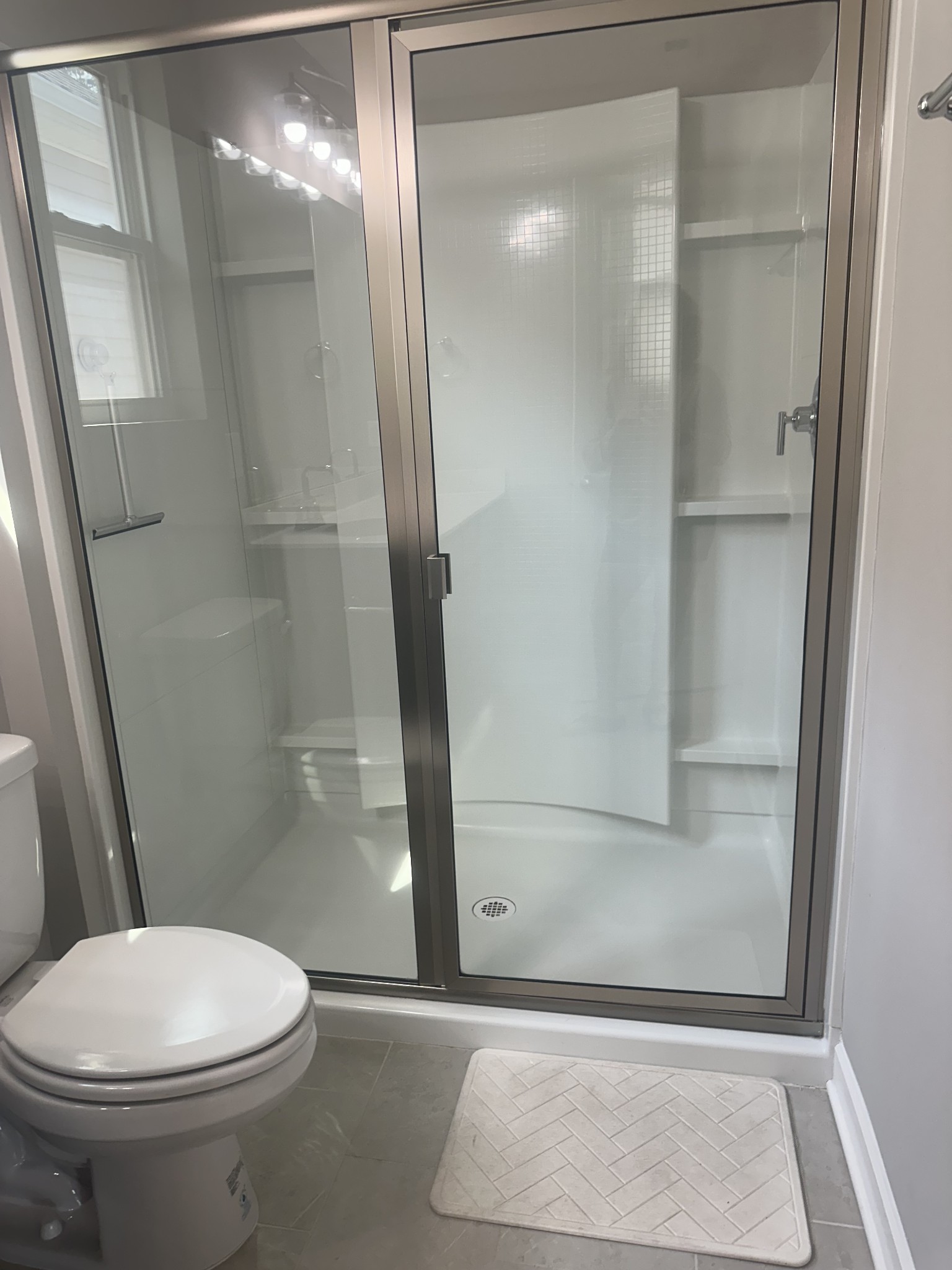 1721 Fenway Loop Antioch, TN 37013 - Photo 29 of 35 a bathroom with a toilet and a shower