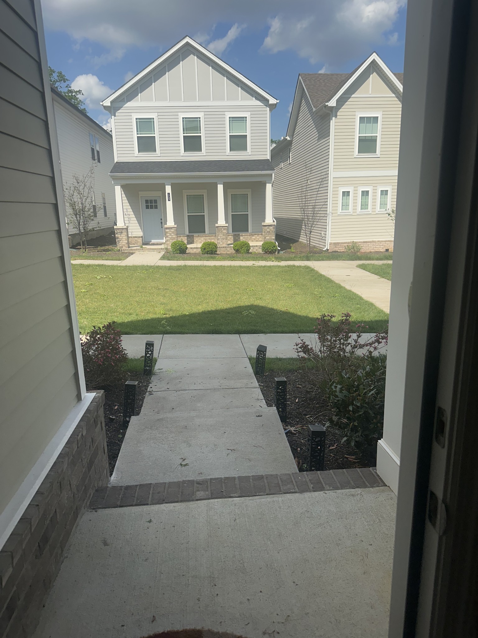 1721 Fenway Loop Antioch, TN 37013 - Photo 3 of 35 a front view of a house with a yard
