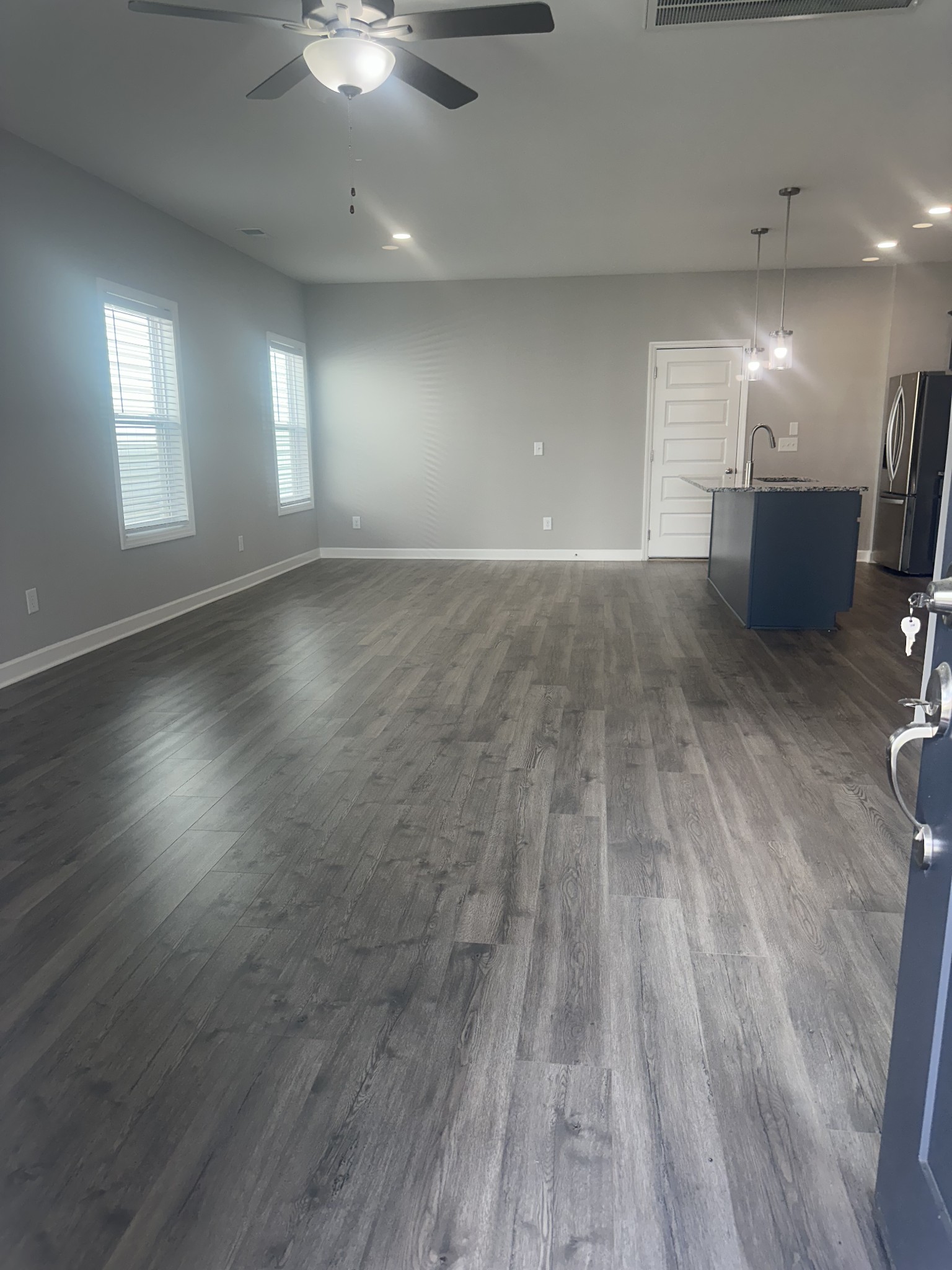 1721 Fenway Loop Antioch, TN 37013 - Photo 4 of 35 an empty room with wooden floor and windows