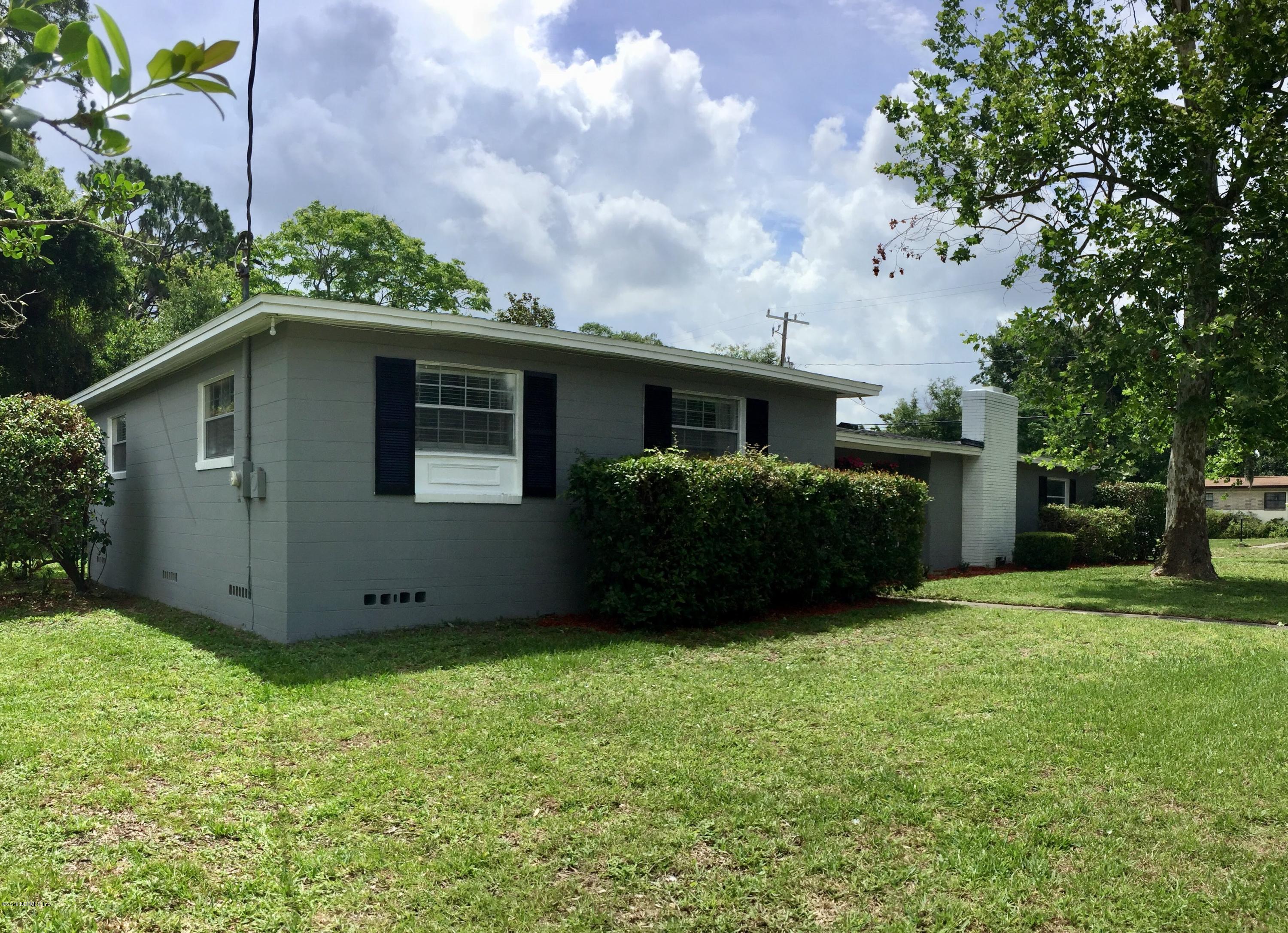 3803 Bess Road Jacksonville, FL 32277 - Photo 2 of 28 a view of an house with backyard space and garden