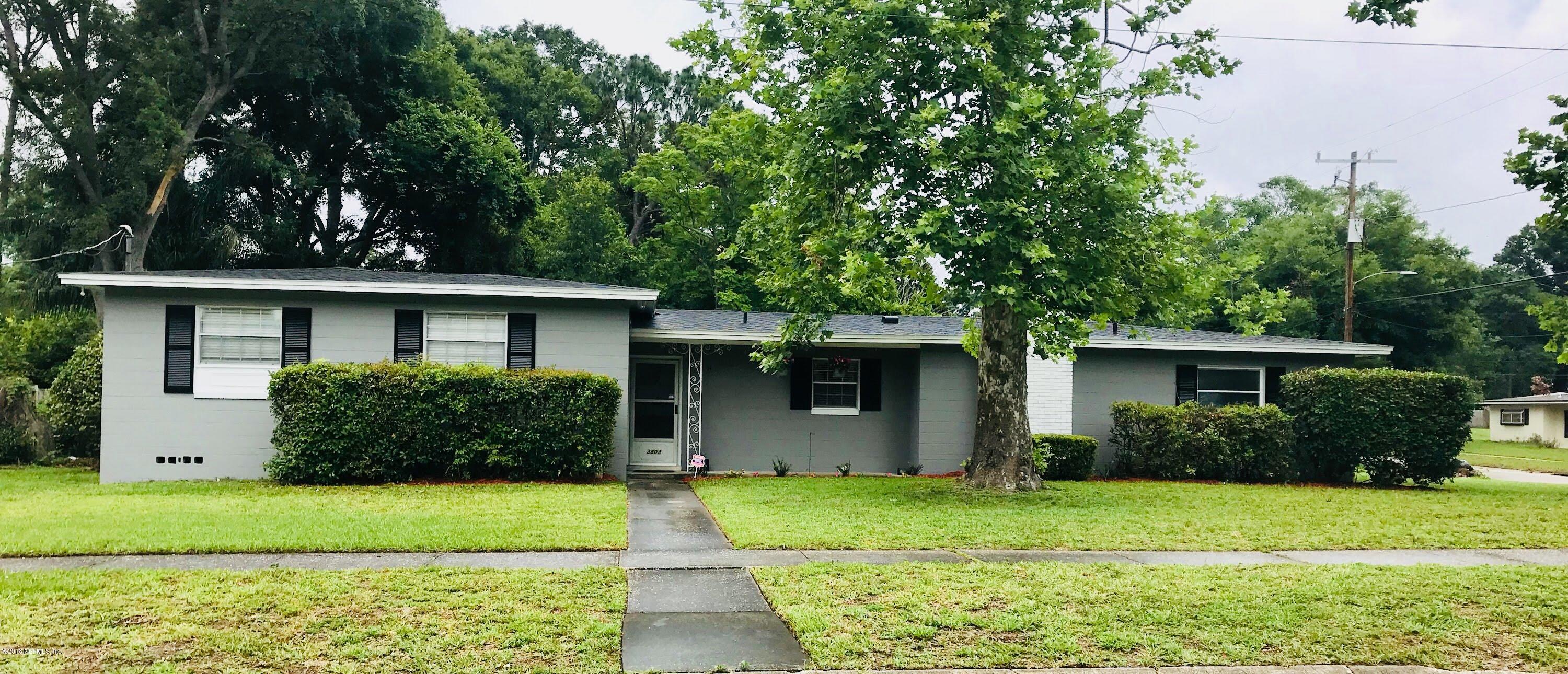 3803 Bess Road Jacksonville, FL 32277 - Photo 3 of 28 a front view of a house with a garden