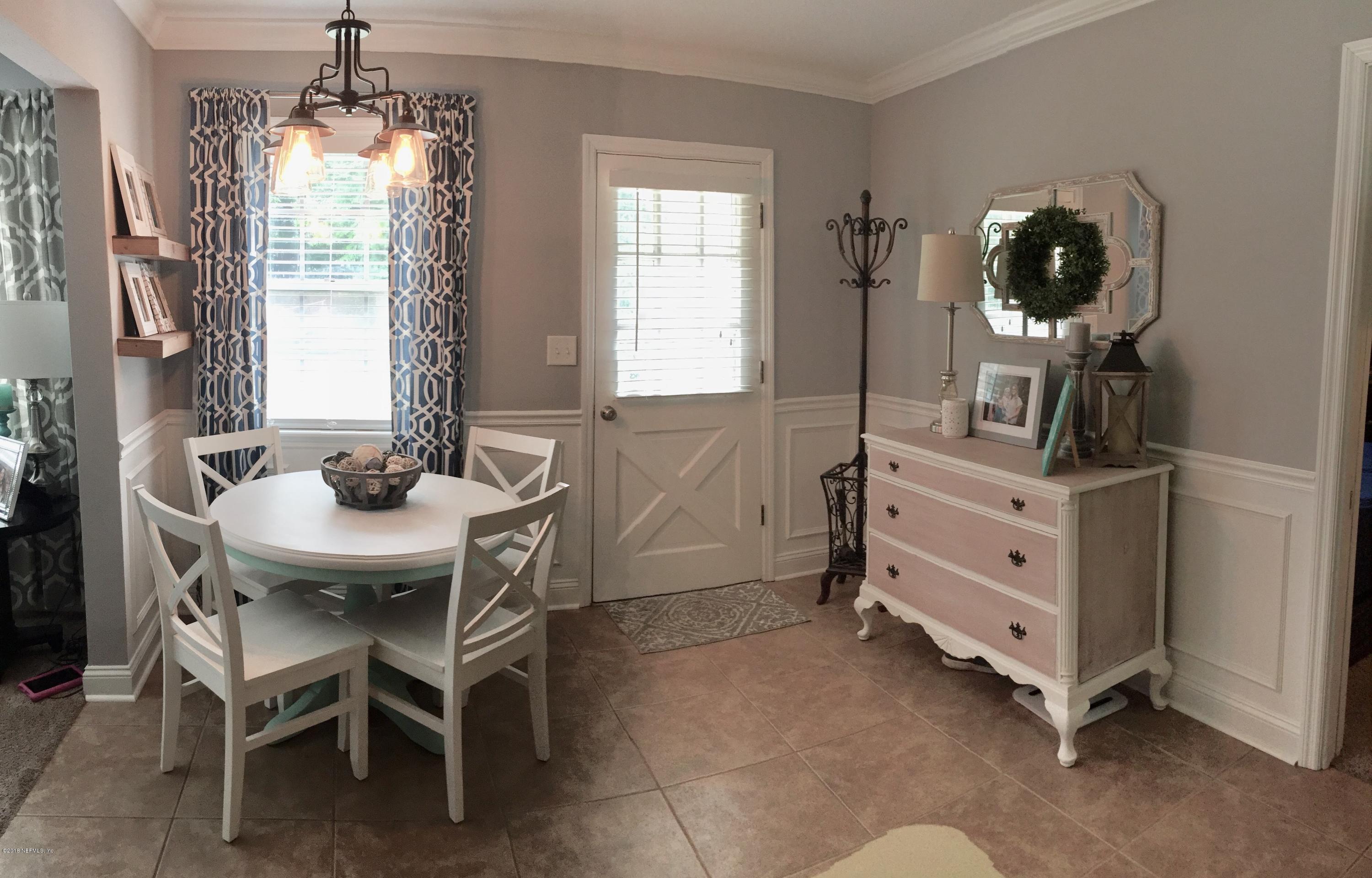 3803 Bess Road Jacksonville, FL 32277 - Photo 7 of 28 a dining room with furniture and window
