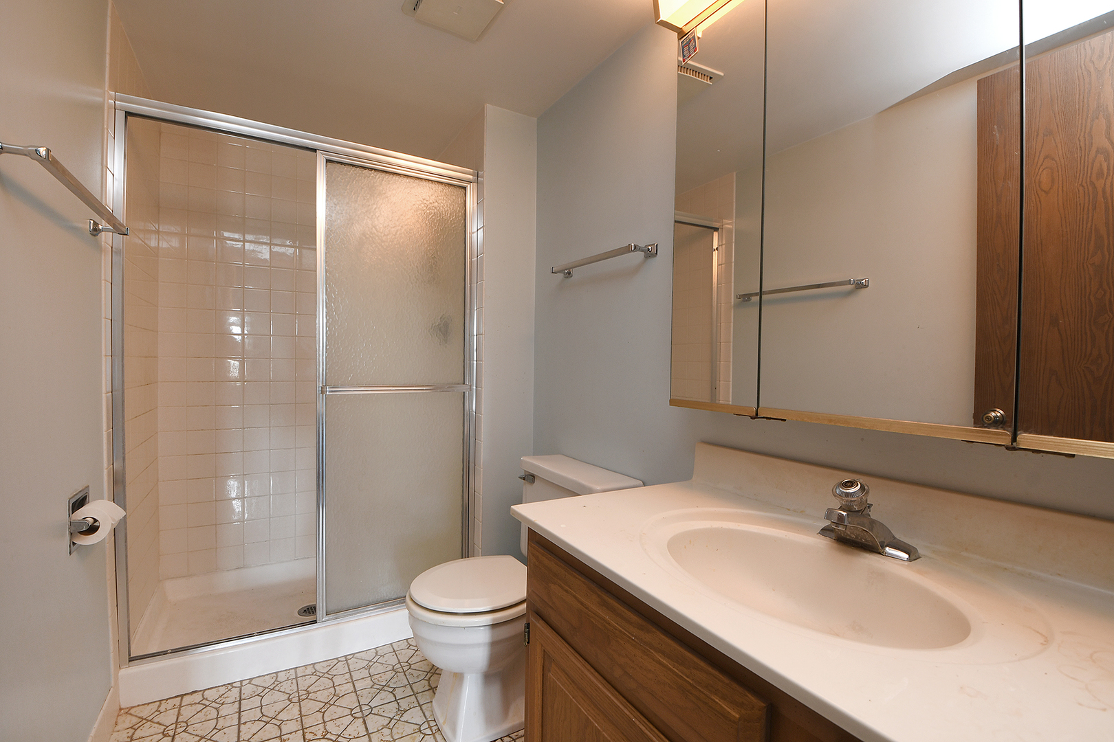 11137 E Road, Unit E Palos Hills, IL 60465 - Photo 17 of 34 a bathroom with a sink toilet and shower