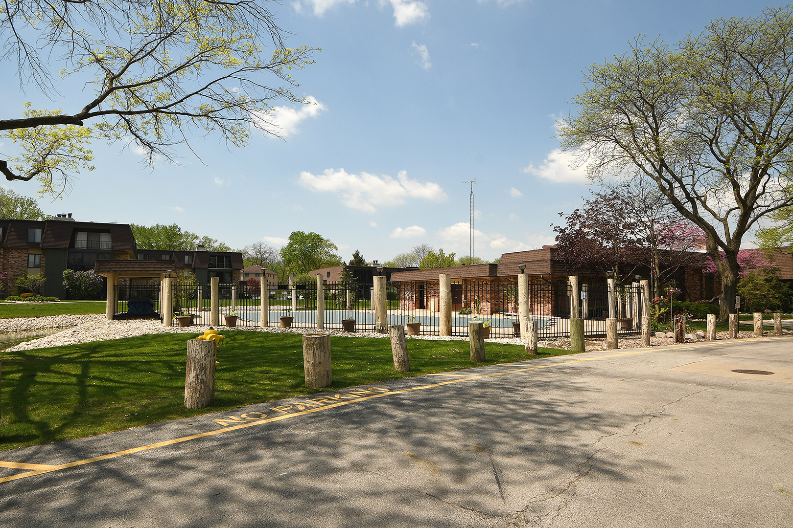 11137 E Road, Unit E Palos Hills, IL 60465 - Photo 29 of 34 a front view of a building with a yard