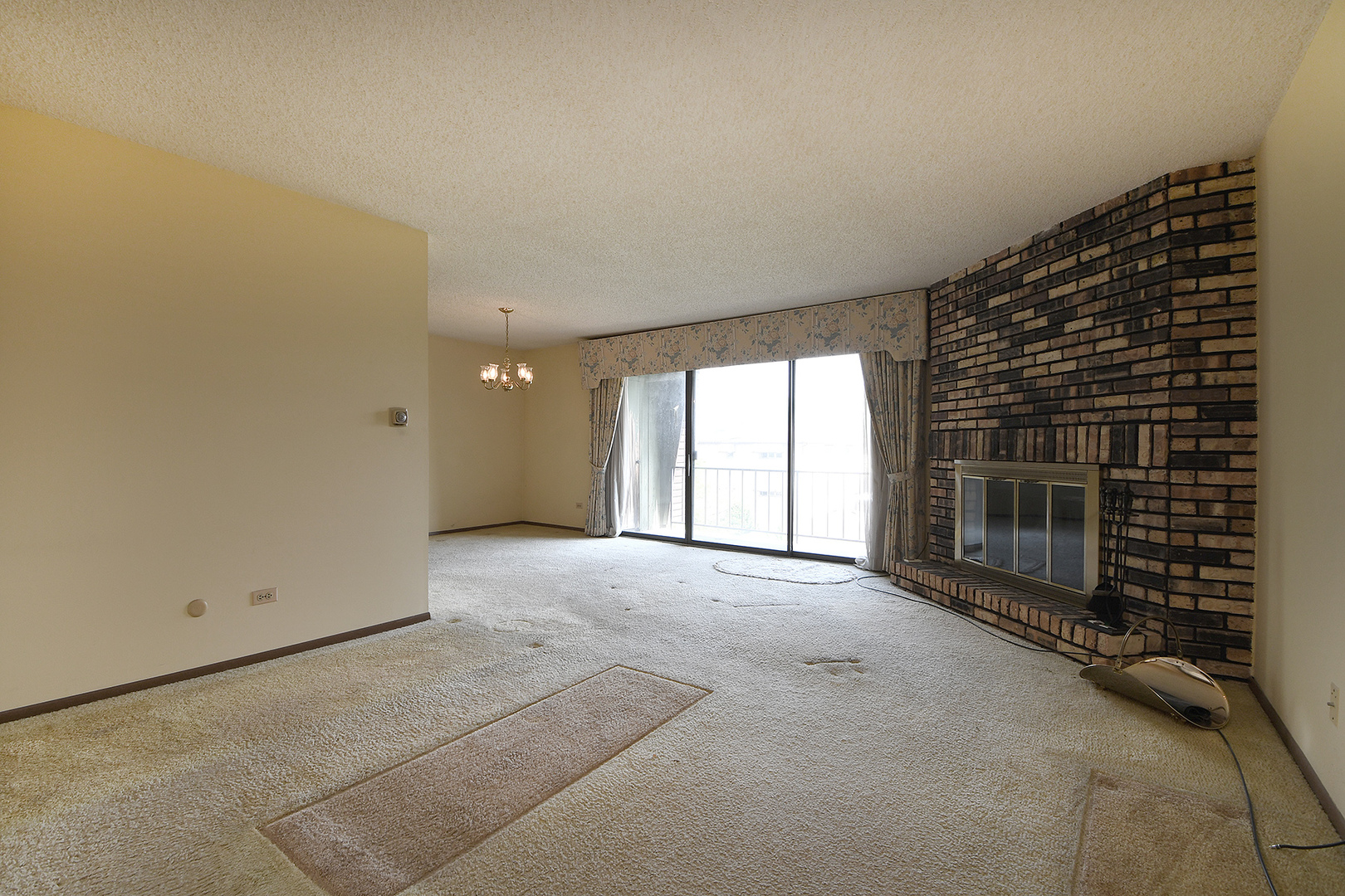 11137 E Road, Unit E Palos Hills, IL 60465 - Photo 3 of 34 a view of an empty room with a fireplace