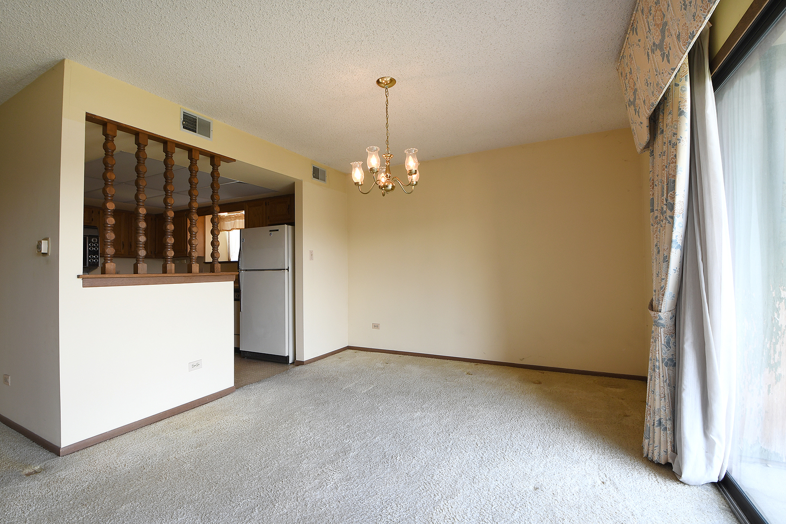 11137 E Road, Unit E Palos Hills, IL 60465 - Photo 7 of 34 a view of a room with a chandelier