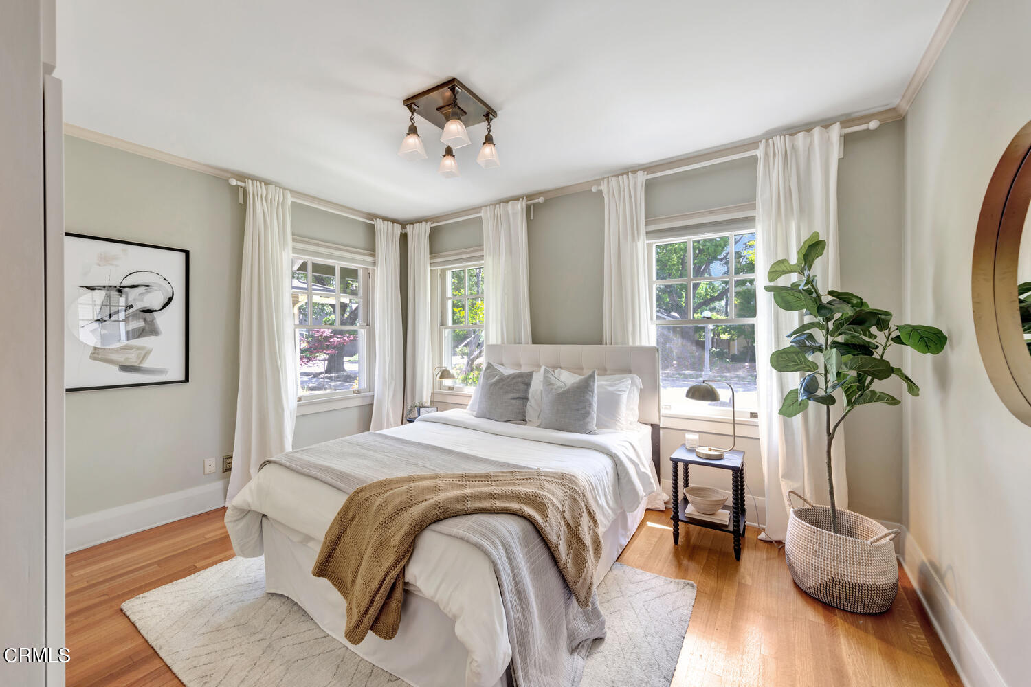 465 Alpine Street Pasadena, CA 91106 - Photo 12 of 45 a bedroom with a bed and a potted plant