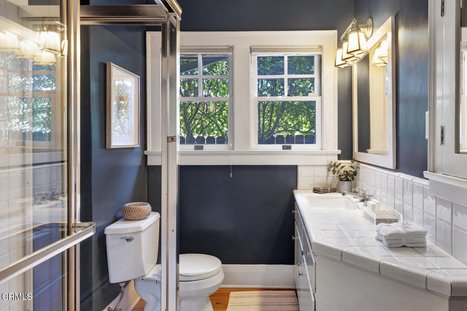 465 Alpine Street Pasadena, CA 91106 - Photo 14 of 45 a bathroom with a sink a toilet a mirror and window