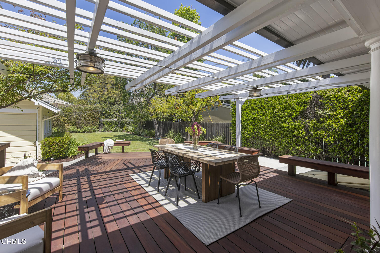 465 Alpine Street Pasadena, CA 91106 - Photo 29 of 45 a view of a patio with table and chairs a barbeque with wooden floor and fence