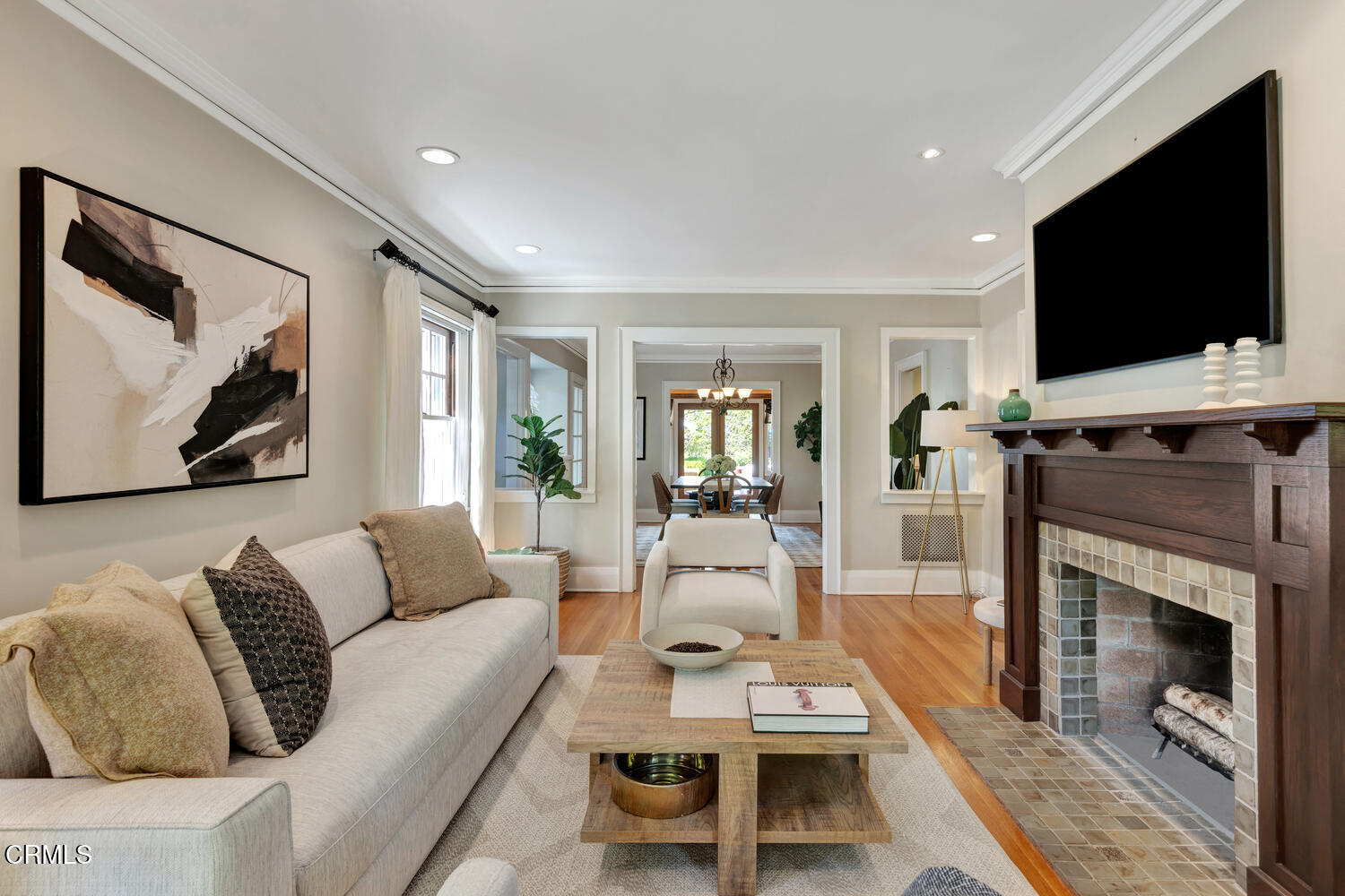 465 Alpine Street Pasadena, CA 91106 - Photo 5 of 45 a living room with furniture a flat screen tv and a fireplace