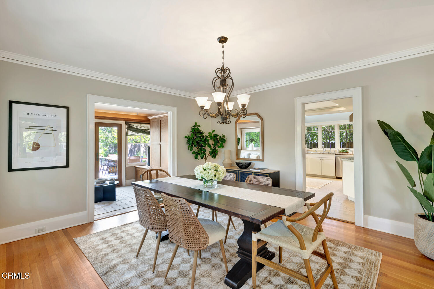 465 Alpine Street Pasadena, CA 91106 - Photo 6 of 45 a dining room with wooden floor a chandelier a wooden table and chairs