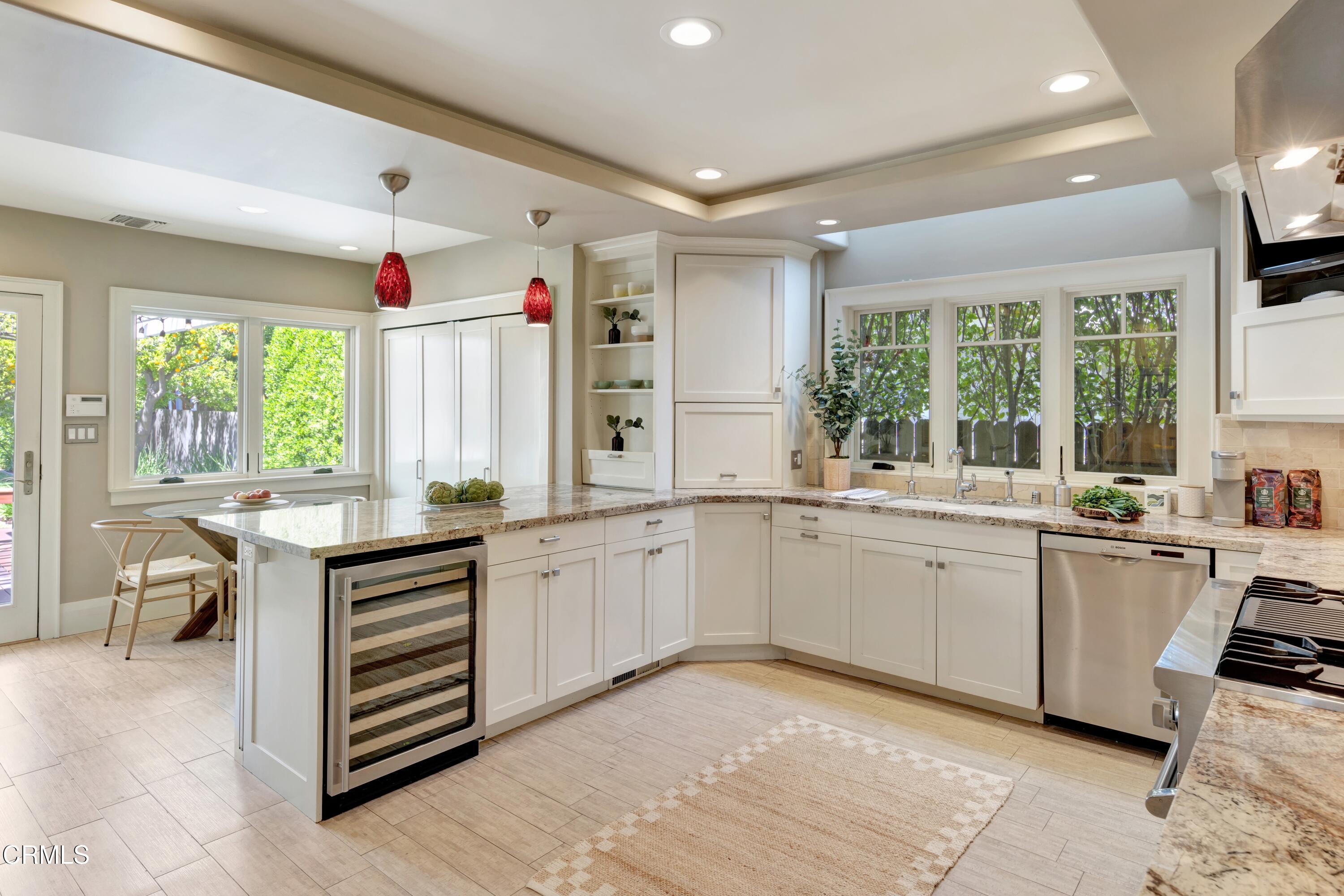 465 Alpine Street Pasadena, CA 91106 - Photo 9 of 45 a kitchen with sink cabinets and wooden floor
