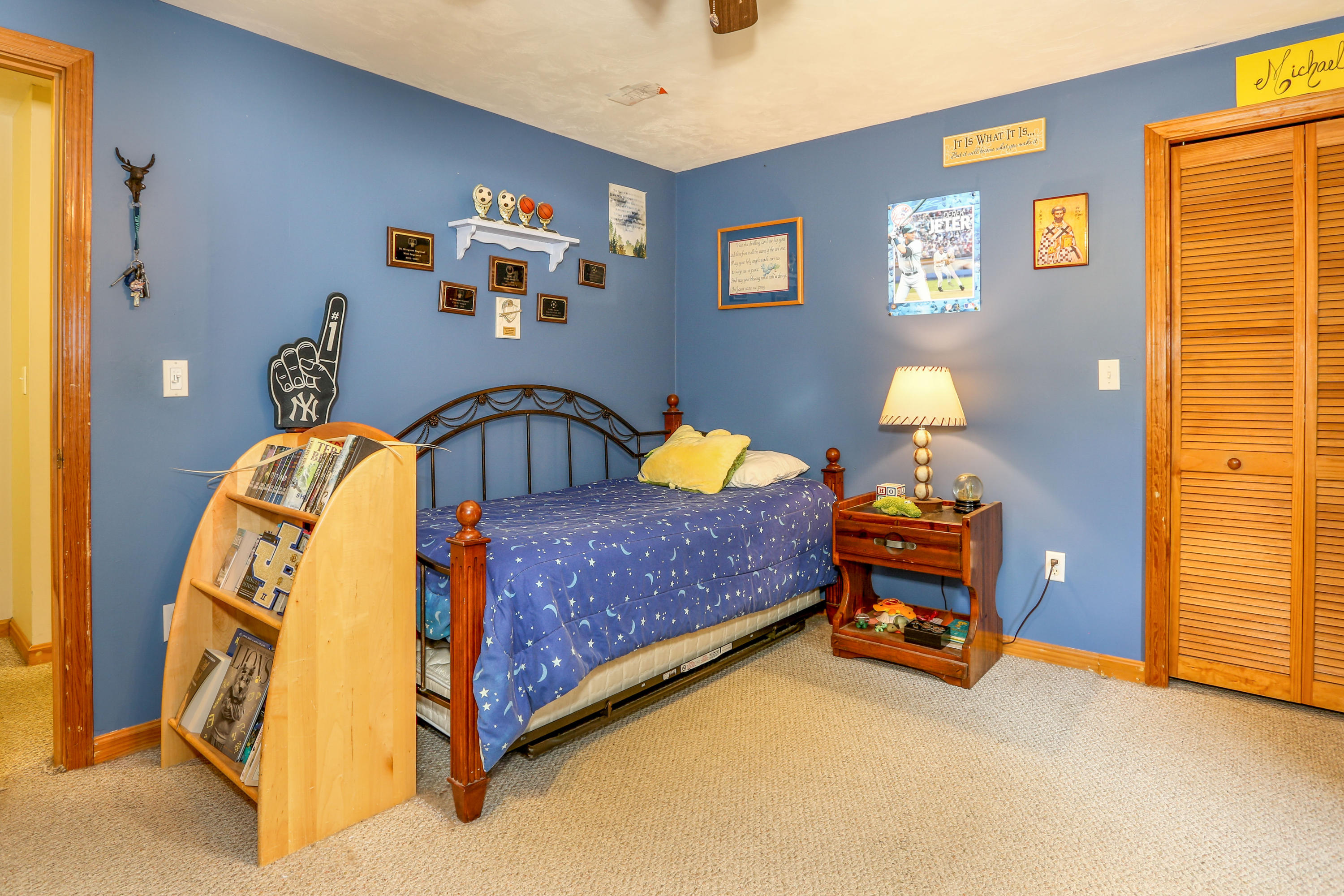 3 Andrew Road Sagamore Beach, MA 02562 - Photo 21 of 29 a bedroom with a bed and wooden floor