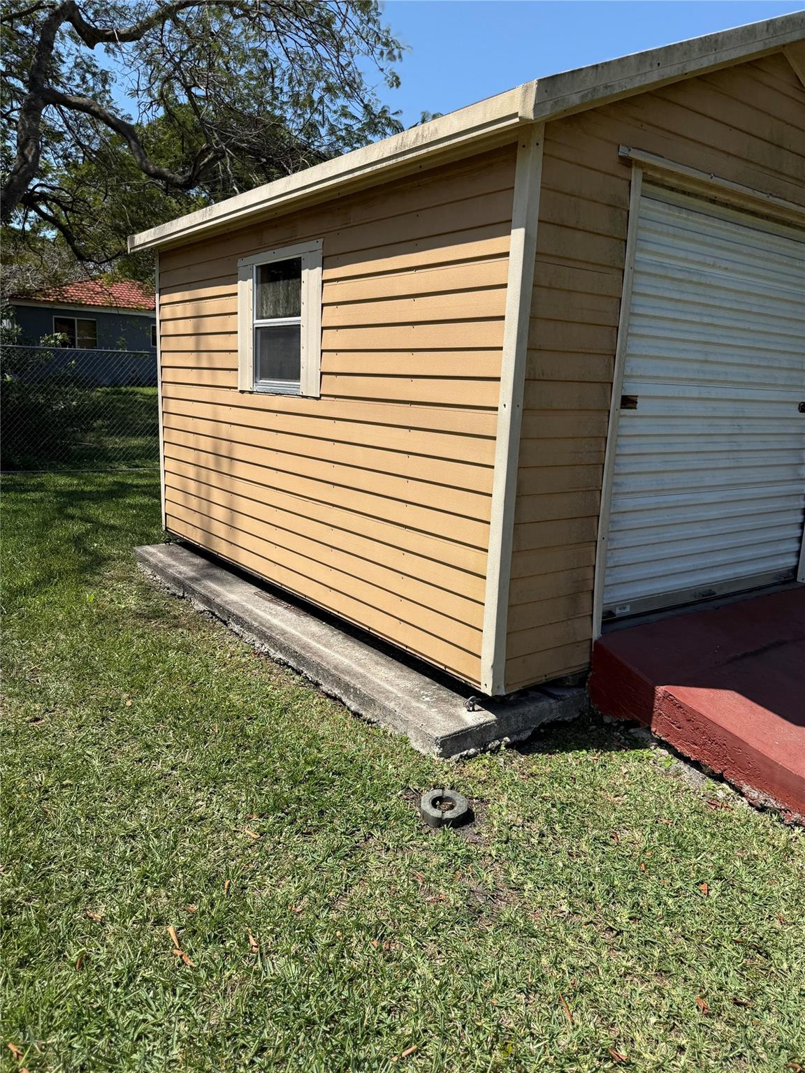 10262 Southwest 179th Street Miami, FL 33157 - Photo 23 of 26 Side of storage shed with window.