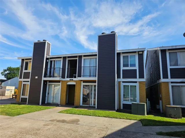 a view of brick building with many windows