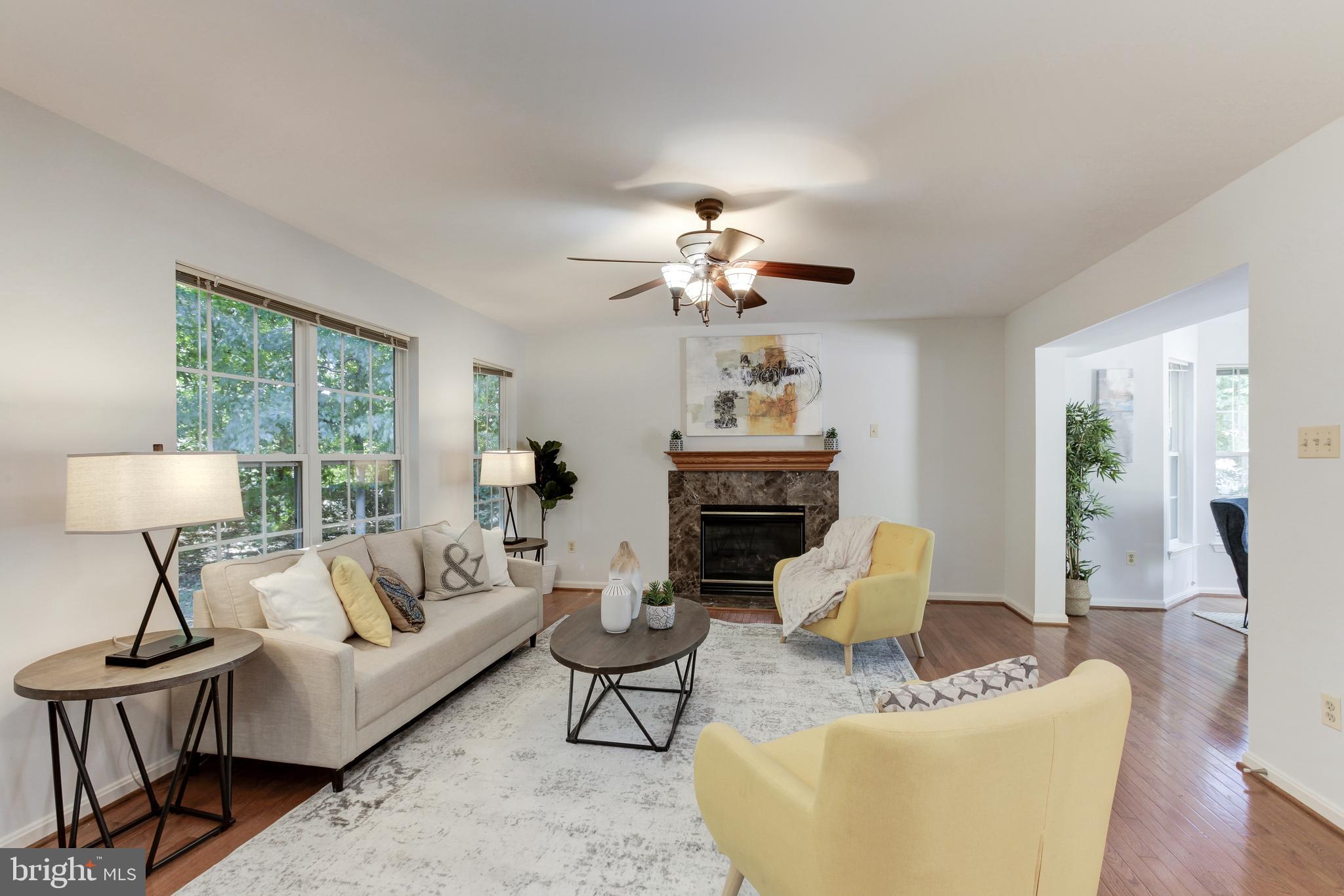 8014 Big Pool Road Laurel, MD 20724 - Photo 11 of 52 a living room with furniture and a fireplace