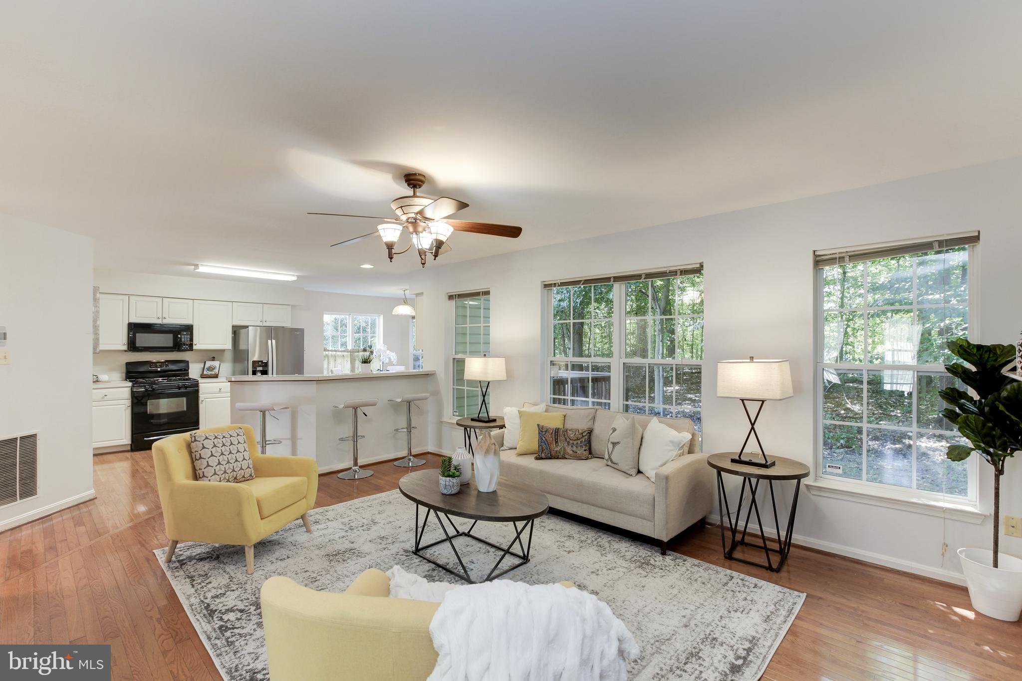 8014 Big Pool Road Laurel, MD 20724 - Photo 13 of 52 a living room with furniture and a chandelier