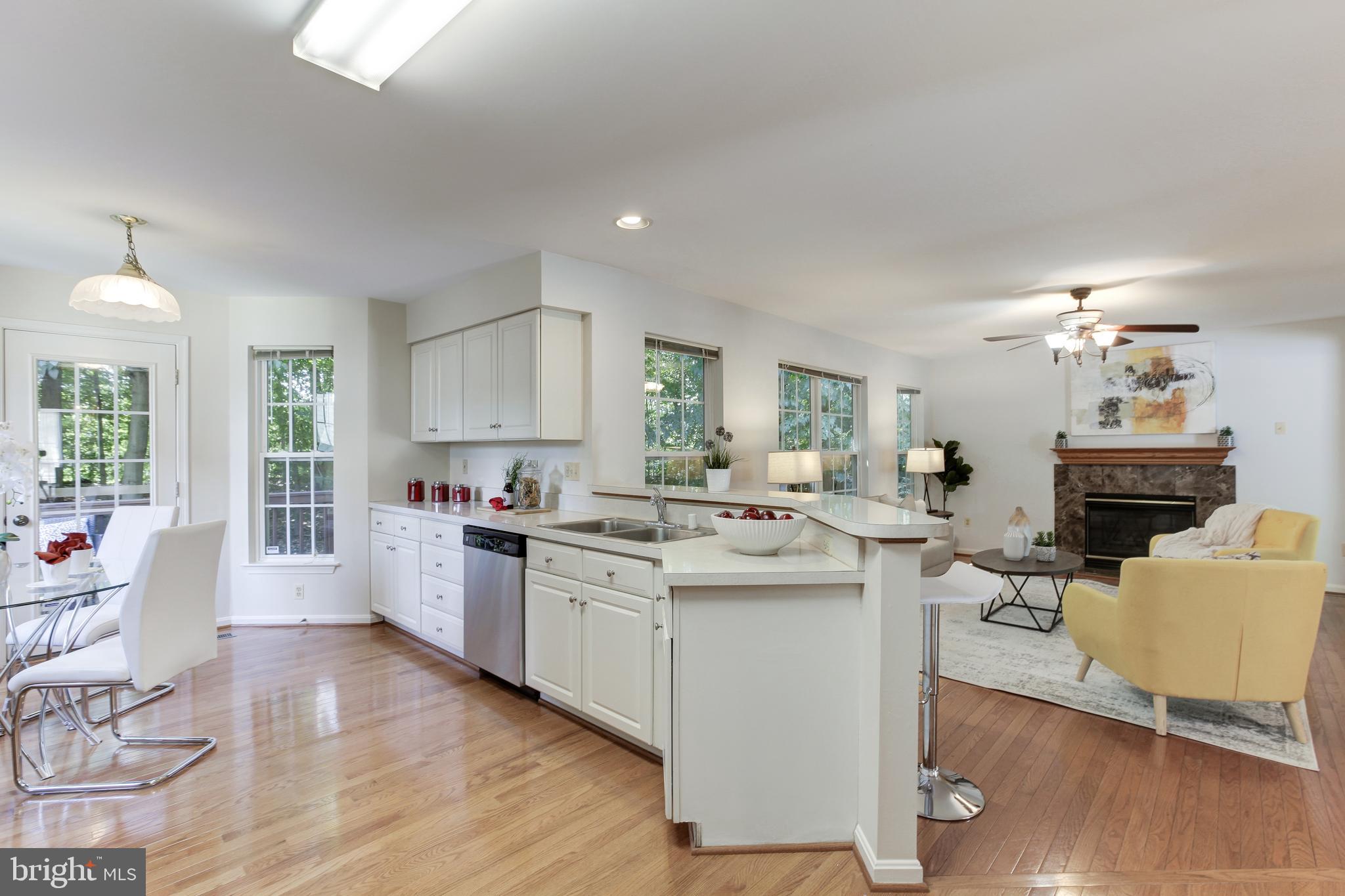8014 Big Pool Road Laurel, MD 20724 - Photo 17 of 52 a kitchen with a sink cabinets and wooden floor