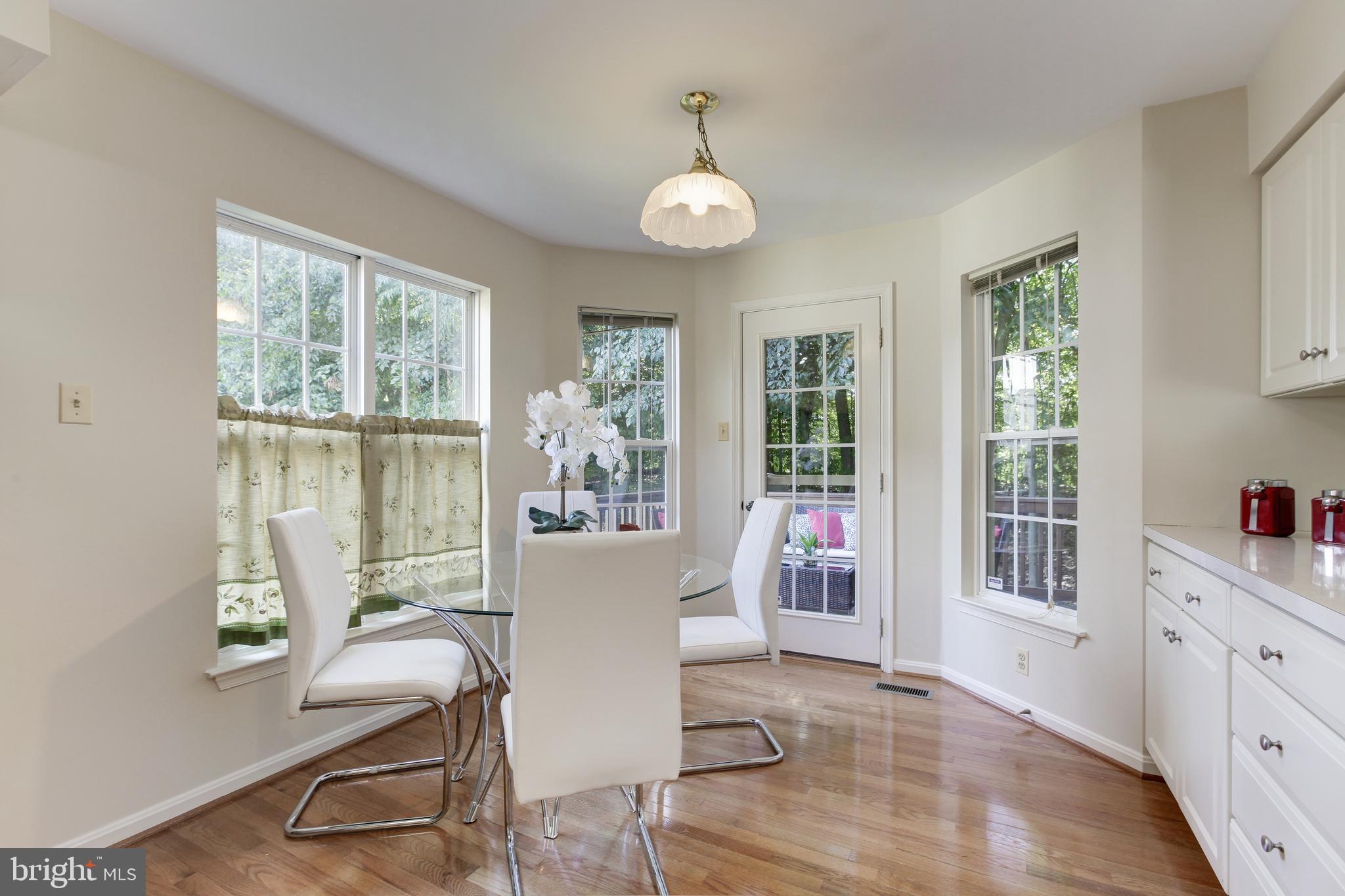 8014 Big Pool Road Laurel, MD 20724 - Photo 18 of 52 a view of a dining room with furniture window and wooden floor