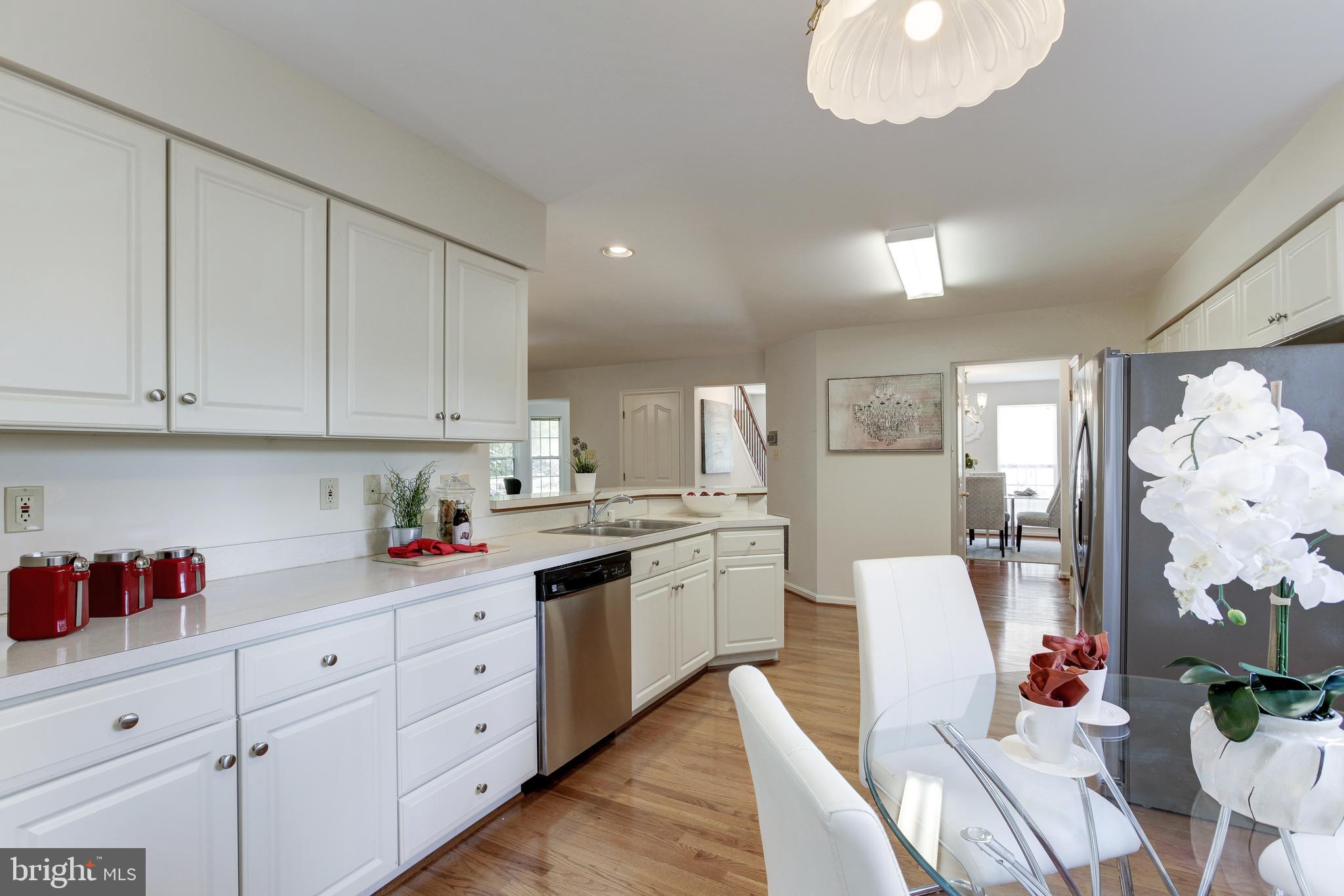 8014 Big Pool Road Laurel, MD 20724 - Photo 19 of 52 a kitchen with white cabinets and sink
